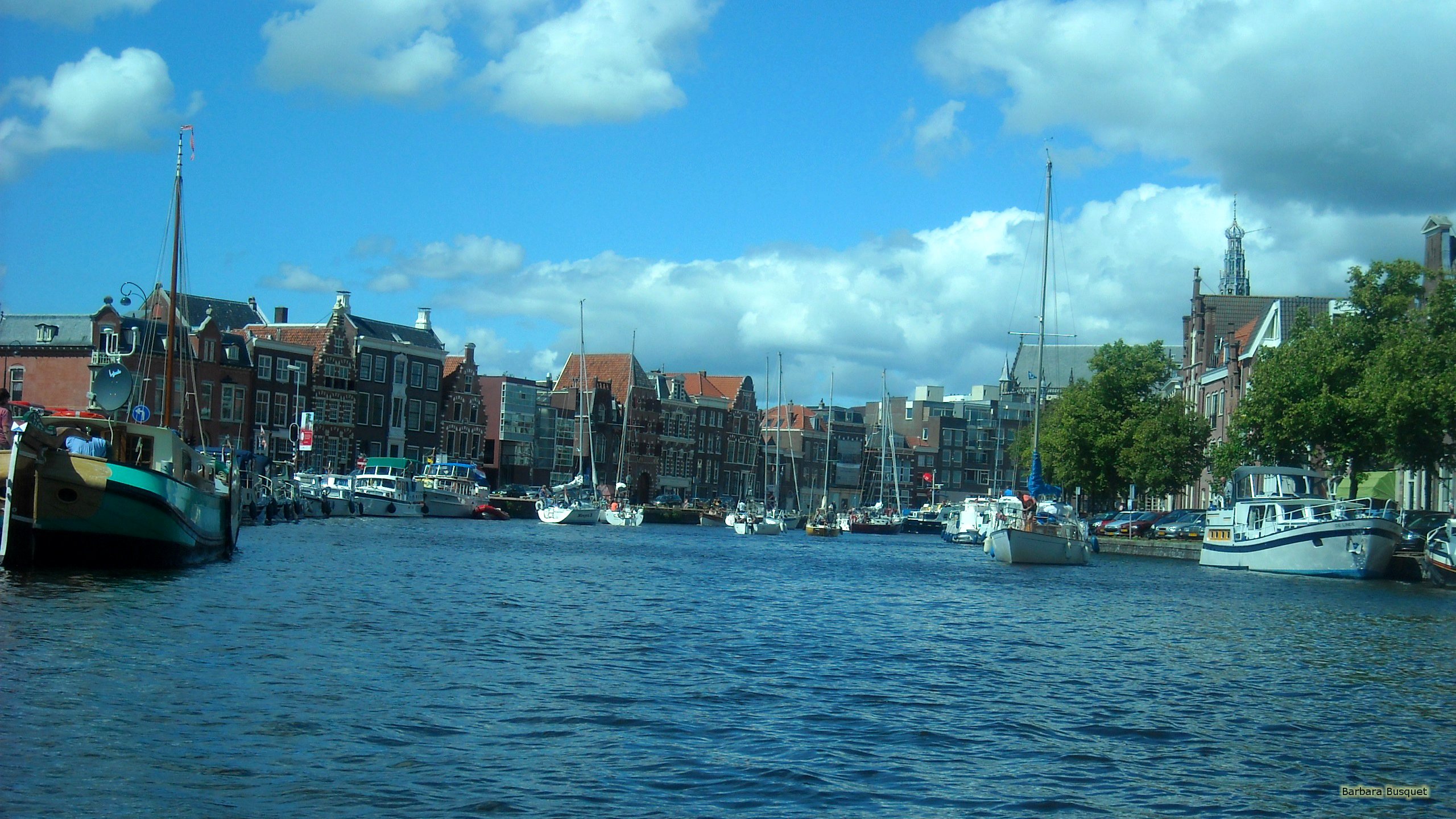 Wallpaper with boats in the Canals of Haarlem on an average day in