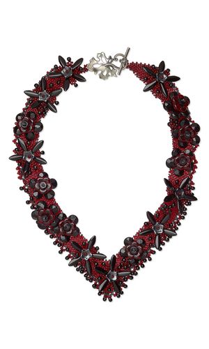 Simple Seed Bead Background Livened Up By Interesting Embellishment
