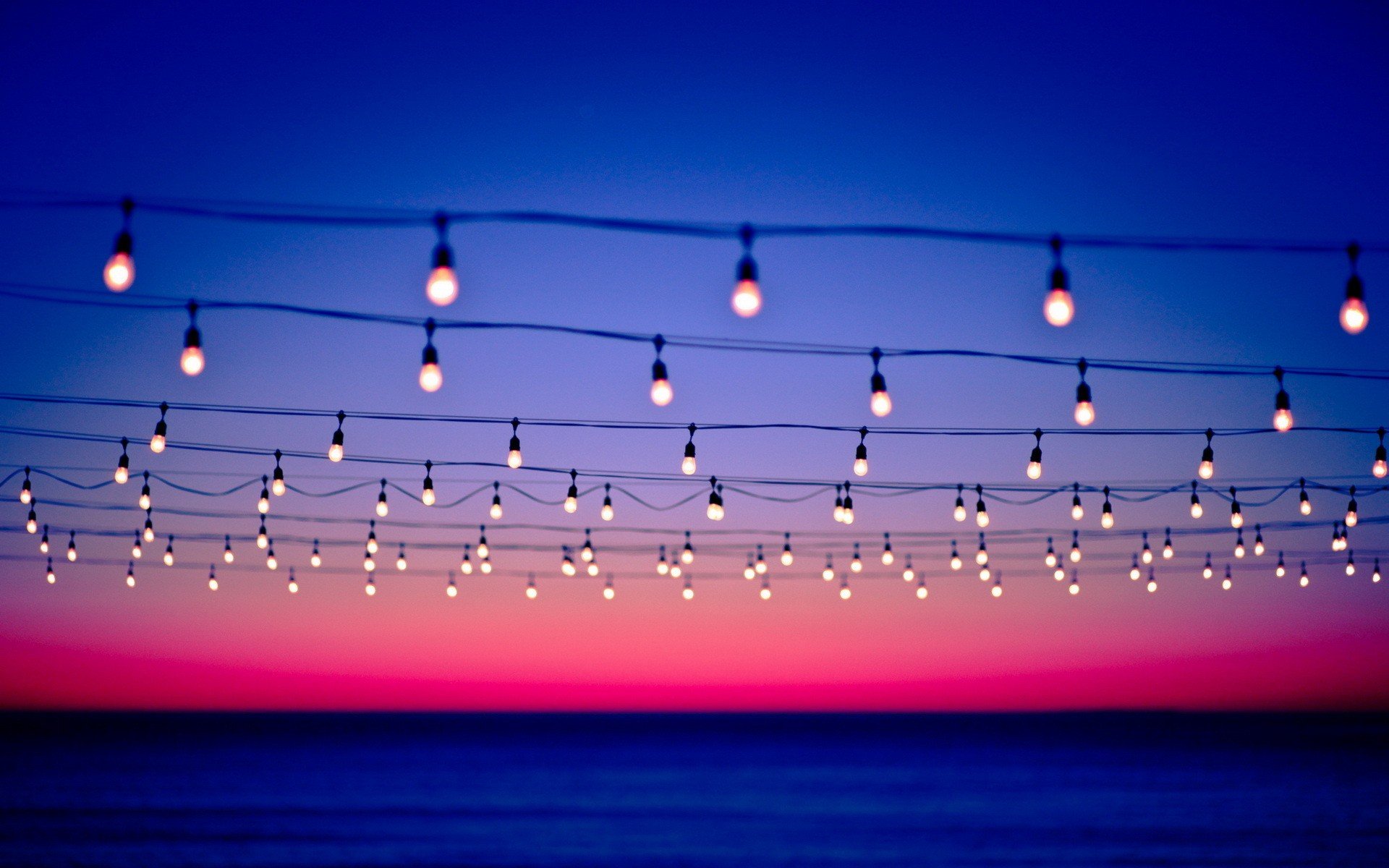 Sunset bokeh power lines light bulbs seascapes wallpaper background