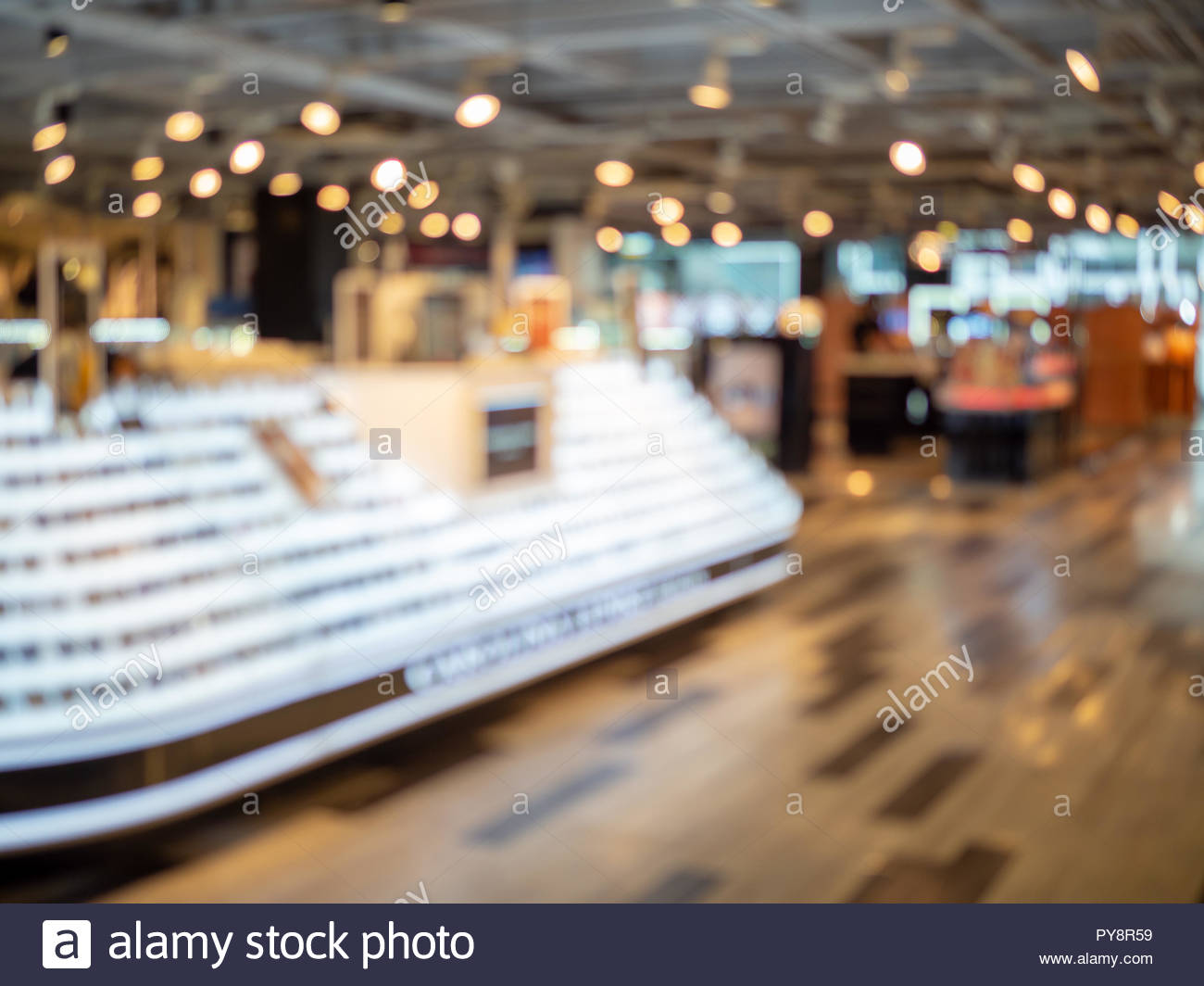 Blurred Shopping Mall Background With Sunglasses On Shelf Display