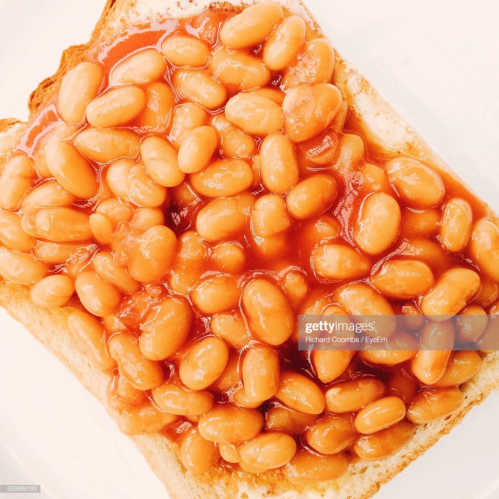 Toast With Baked Beans On White Background High Res Stock Photo