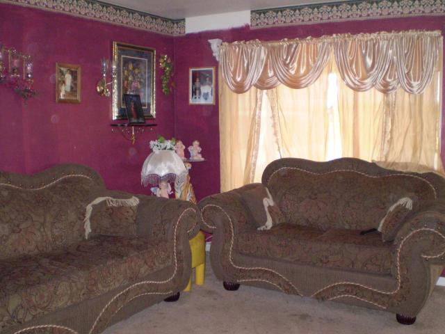  pink paint wallpaper border clutter drapes living room Phoenix home 640x480
