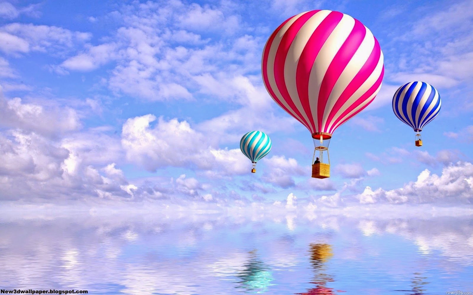 Three hot air balloons soaring over a reflective body of water against a blue, cloudy sky
