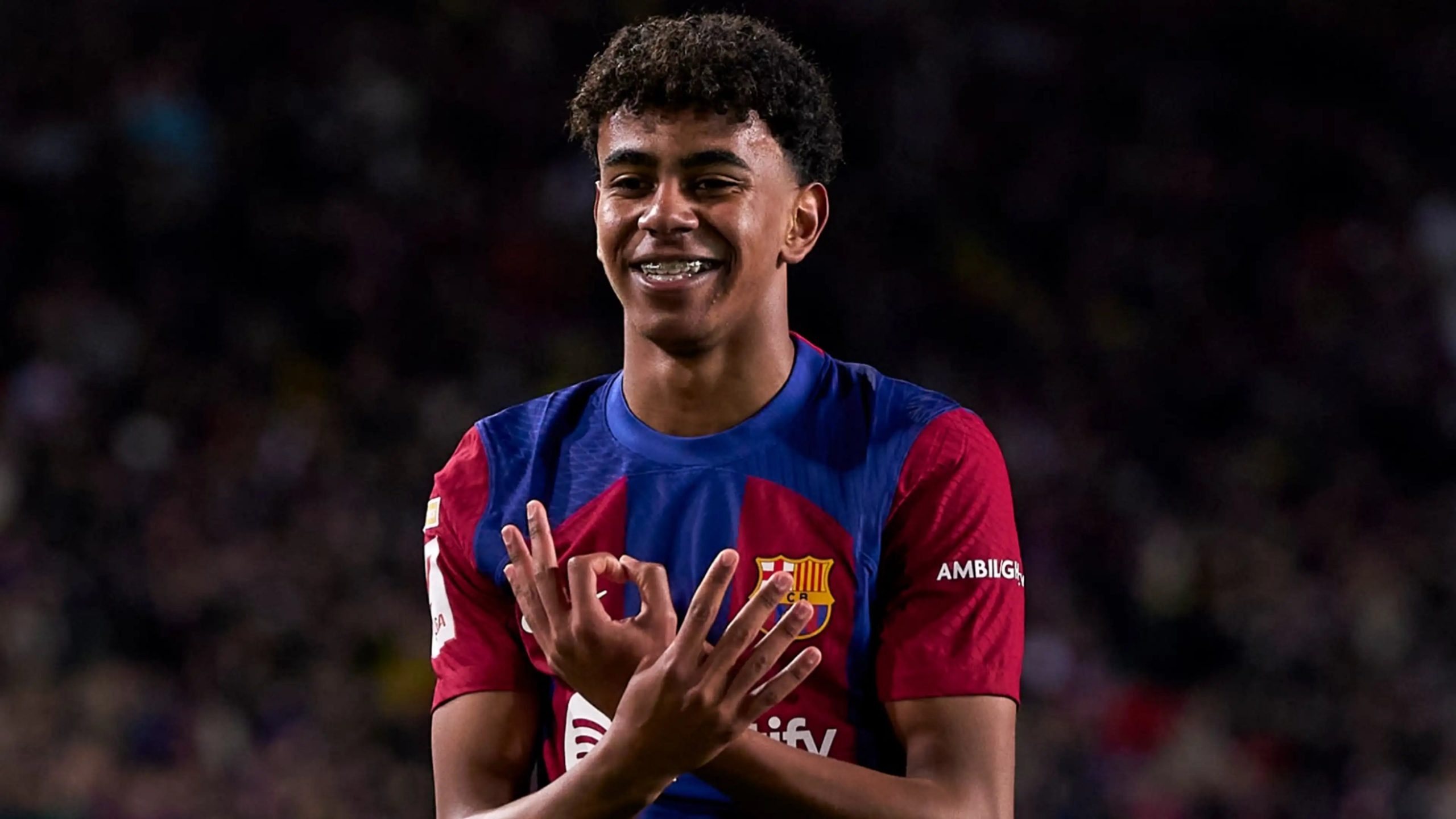 Lamine Yamal of FC Barcelona making the 'OK' hand gesture during a match