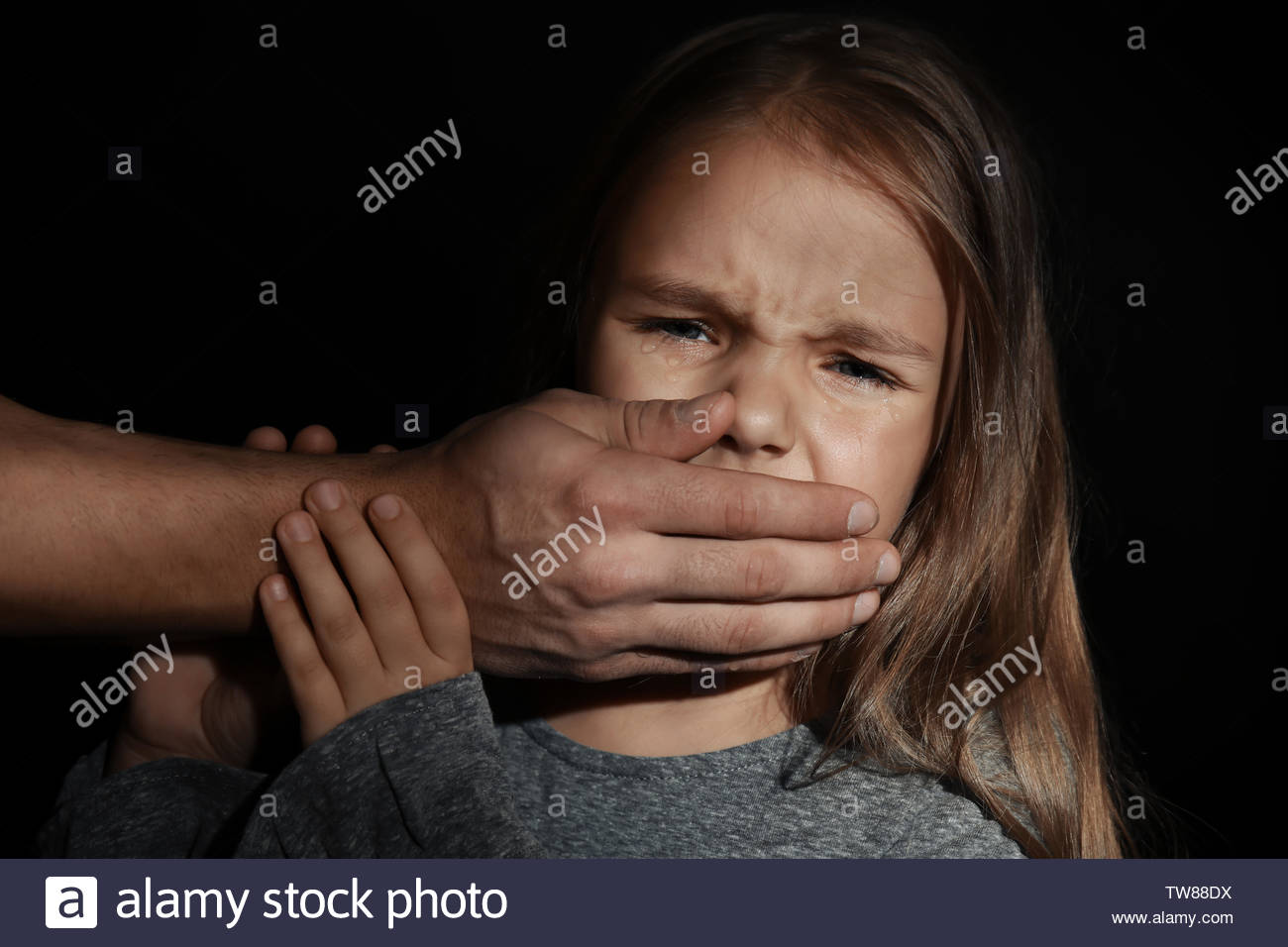 Free download Mans hand covering mouth of little girl on black