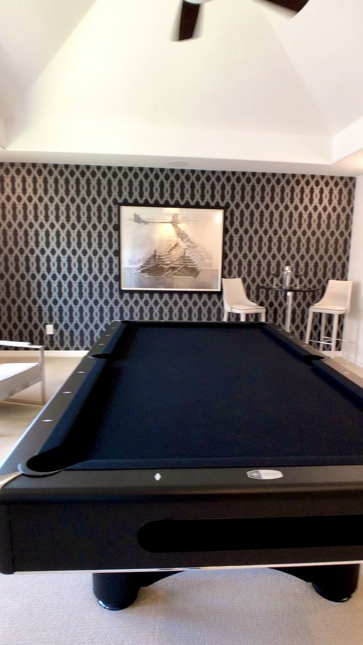 Beautiful Modern Wallpaper In This Gameroom With Black Top Pool