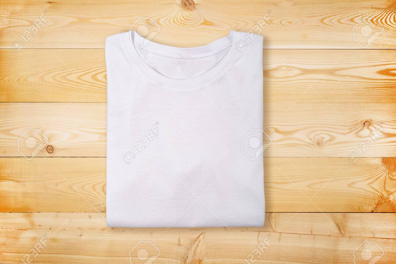 Blank White Folded T Shirt On Wooden Background Plain