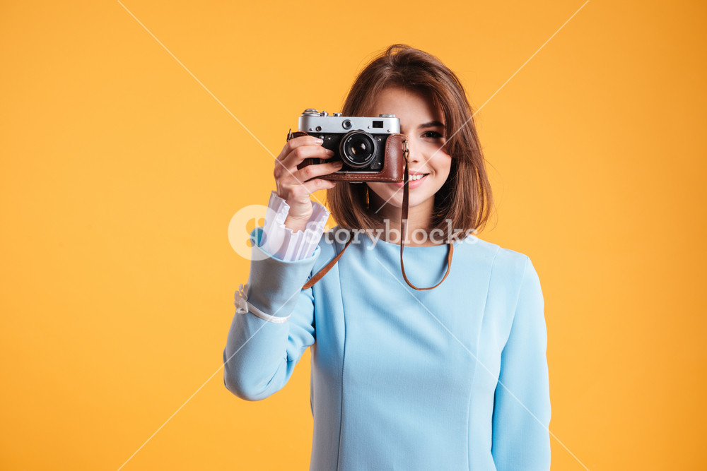 Cheerful Beautiful Young Woman Standing And Taking Photos With Old