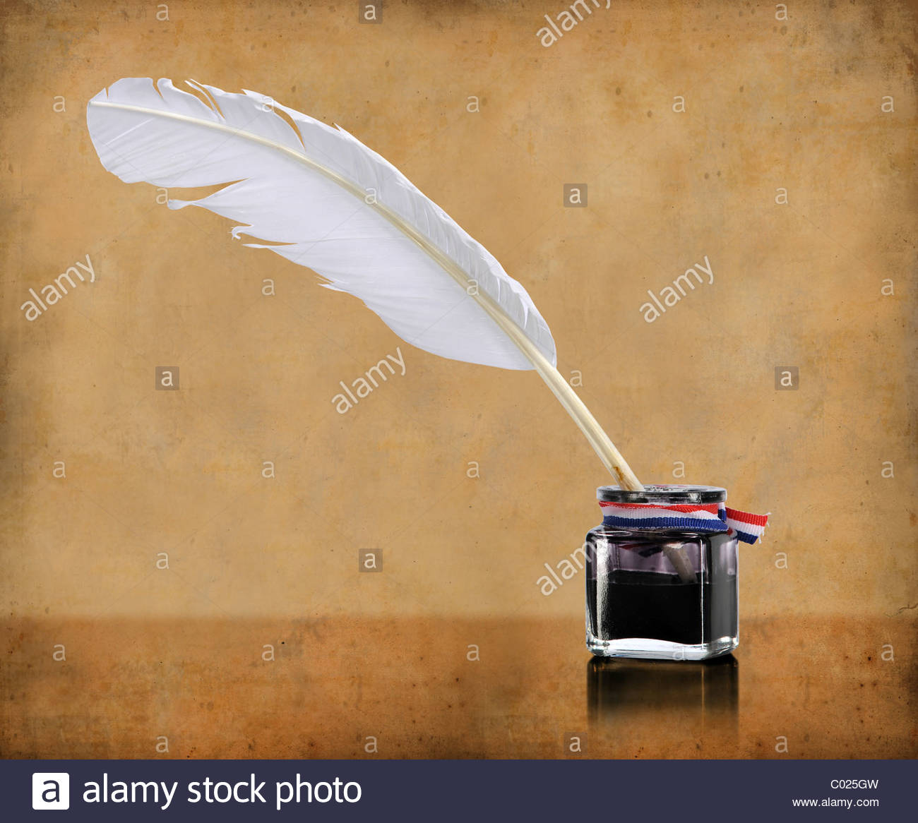 Vintage Writing Quill And Inkwell Over Grunge Background Stock