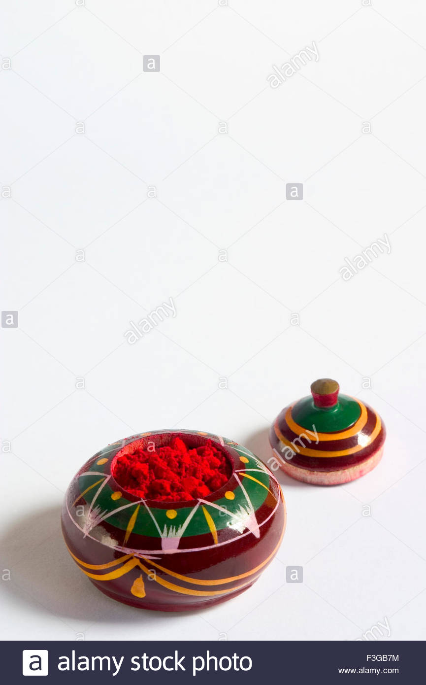 Red Sindoor Or Kumkum Vermillion Powder In Wooden Box On White