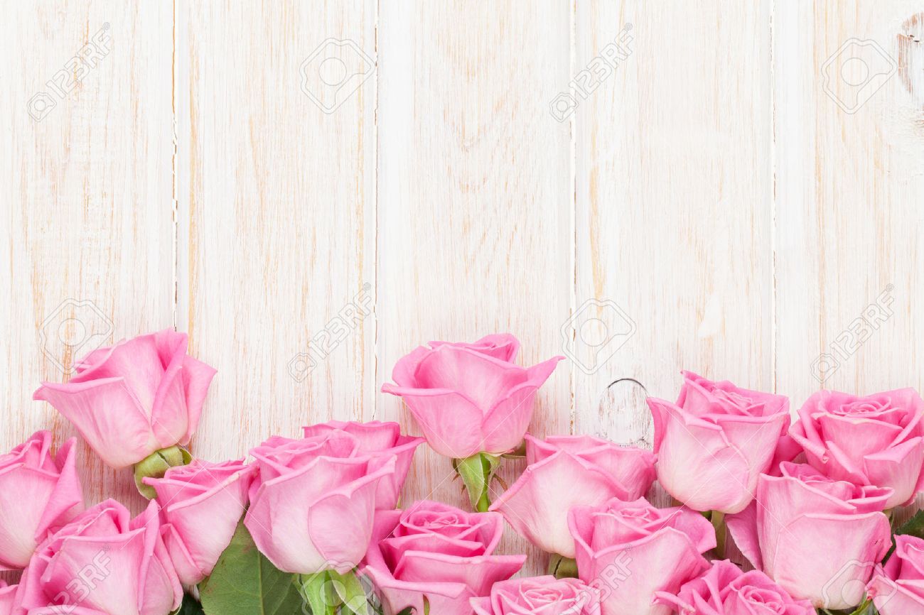 Valentines Day Background With Pink Roses Over Wooden Table