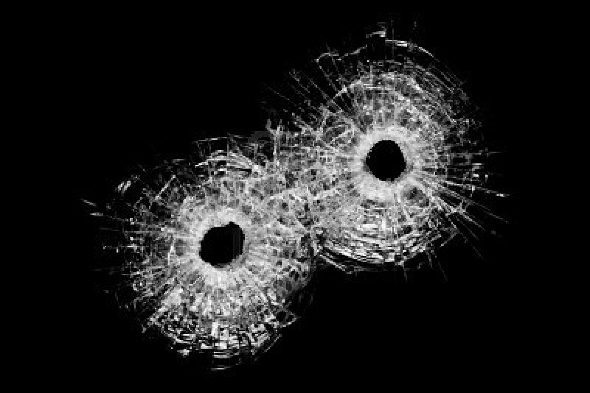 Holes In Glass Authentic Bullet Closeup Isolated On Black Jpg