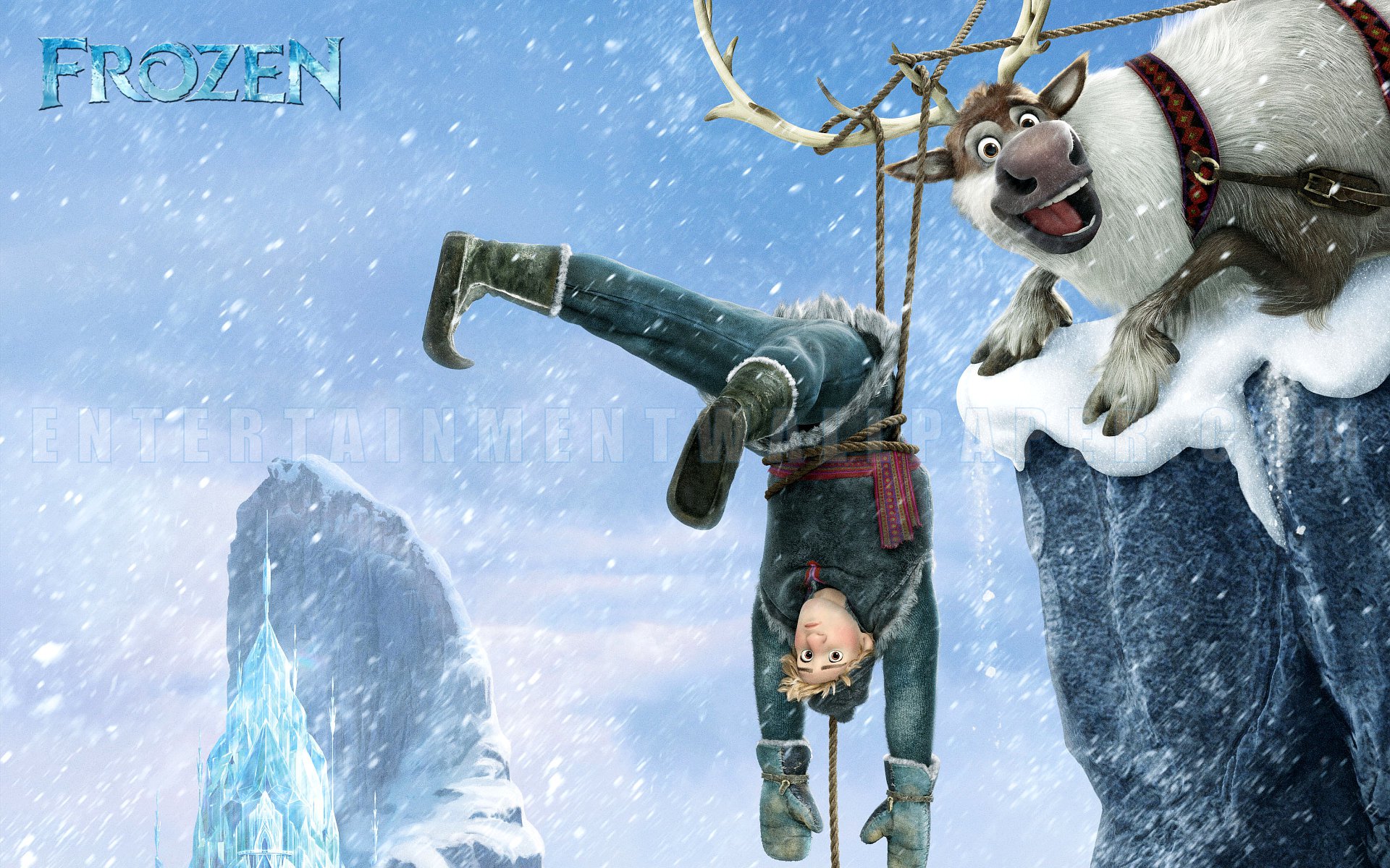 Kristoff hanging upside down from Sven on a snowy cliff in Disney's Frozen