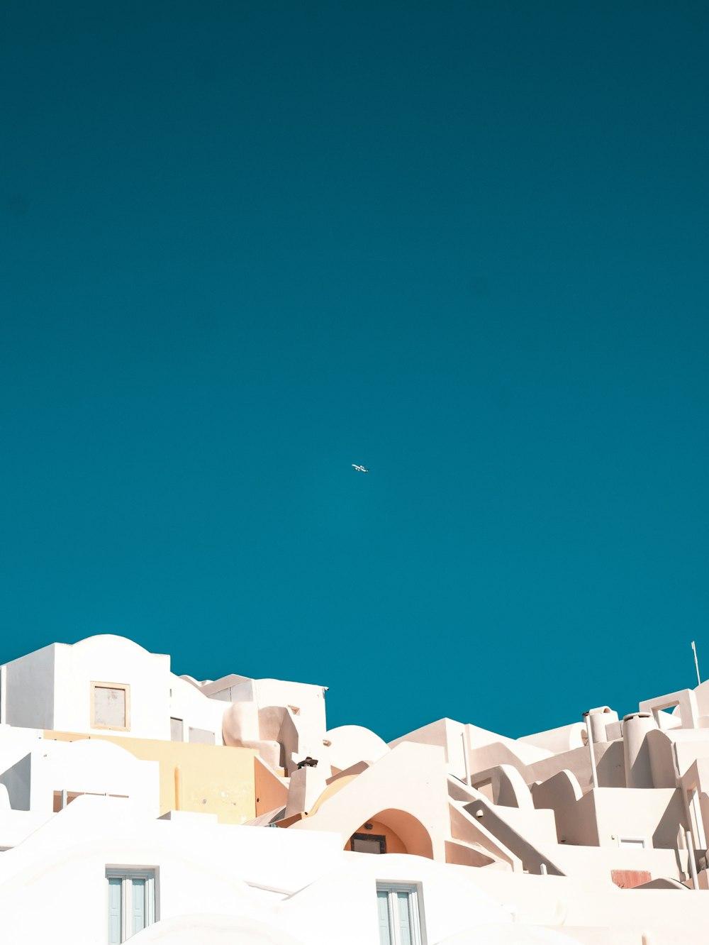 White Concrete Building Under Blue Sky During Daytime Photo