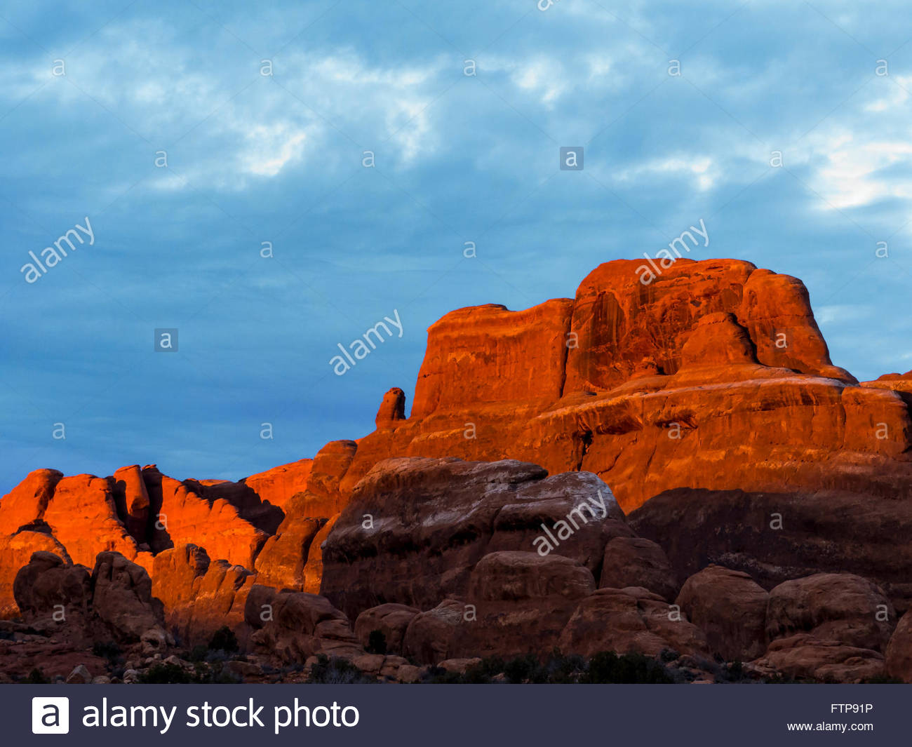A Background Image Of Red Sandstone And Blue Sky Arches National