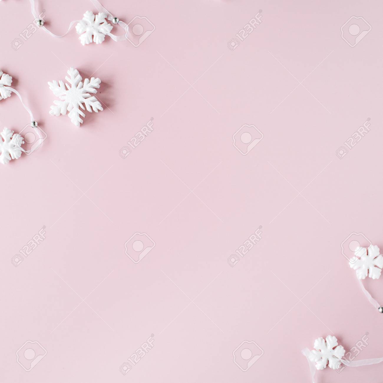 White Christmas Snowflakes Decoration On Pink Background
