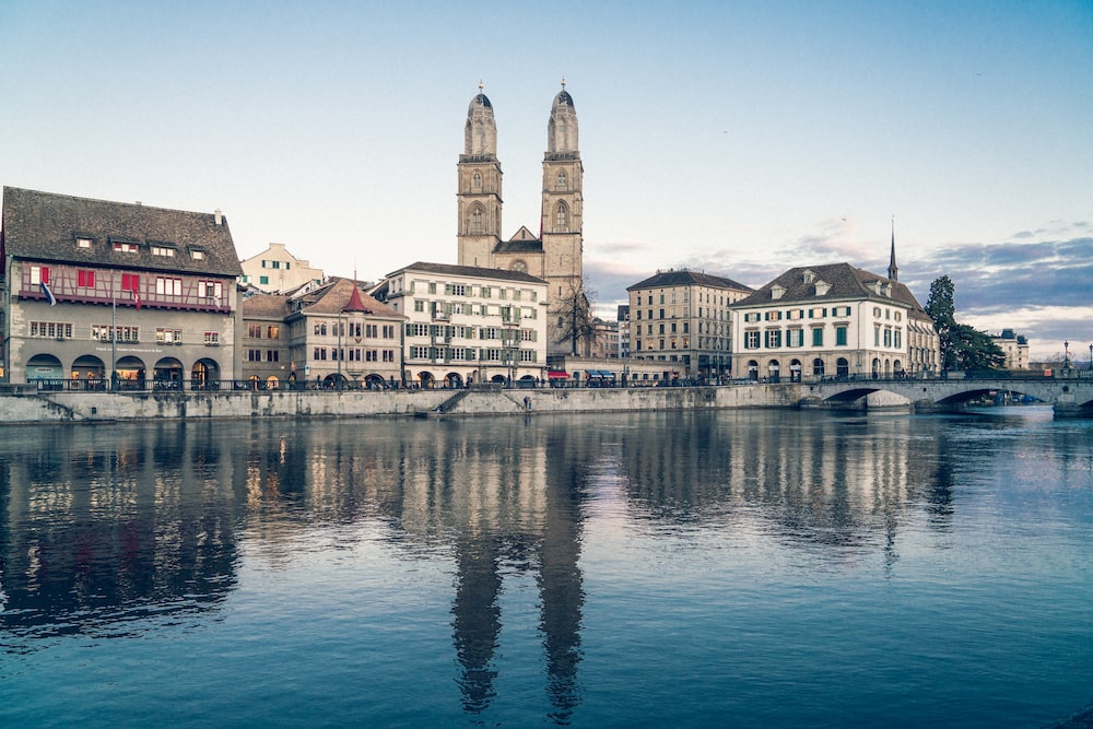 Zurich in Switzerland under white sky during daytime photo Free