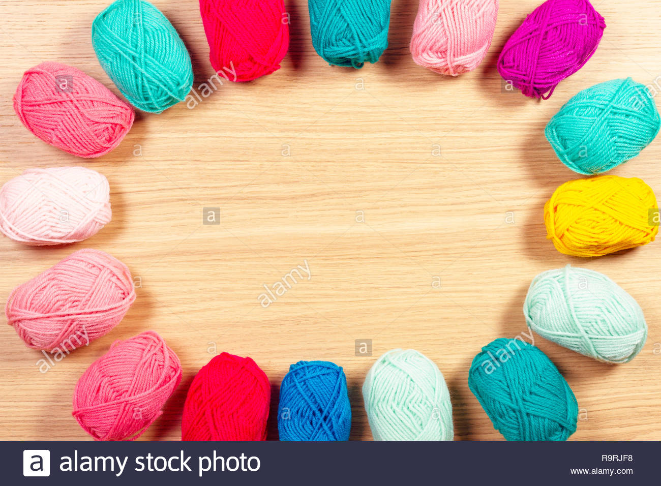Colorful Yarn For Knitting On Wooden Background Stock Photo