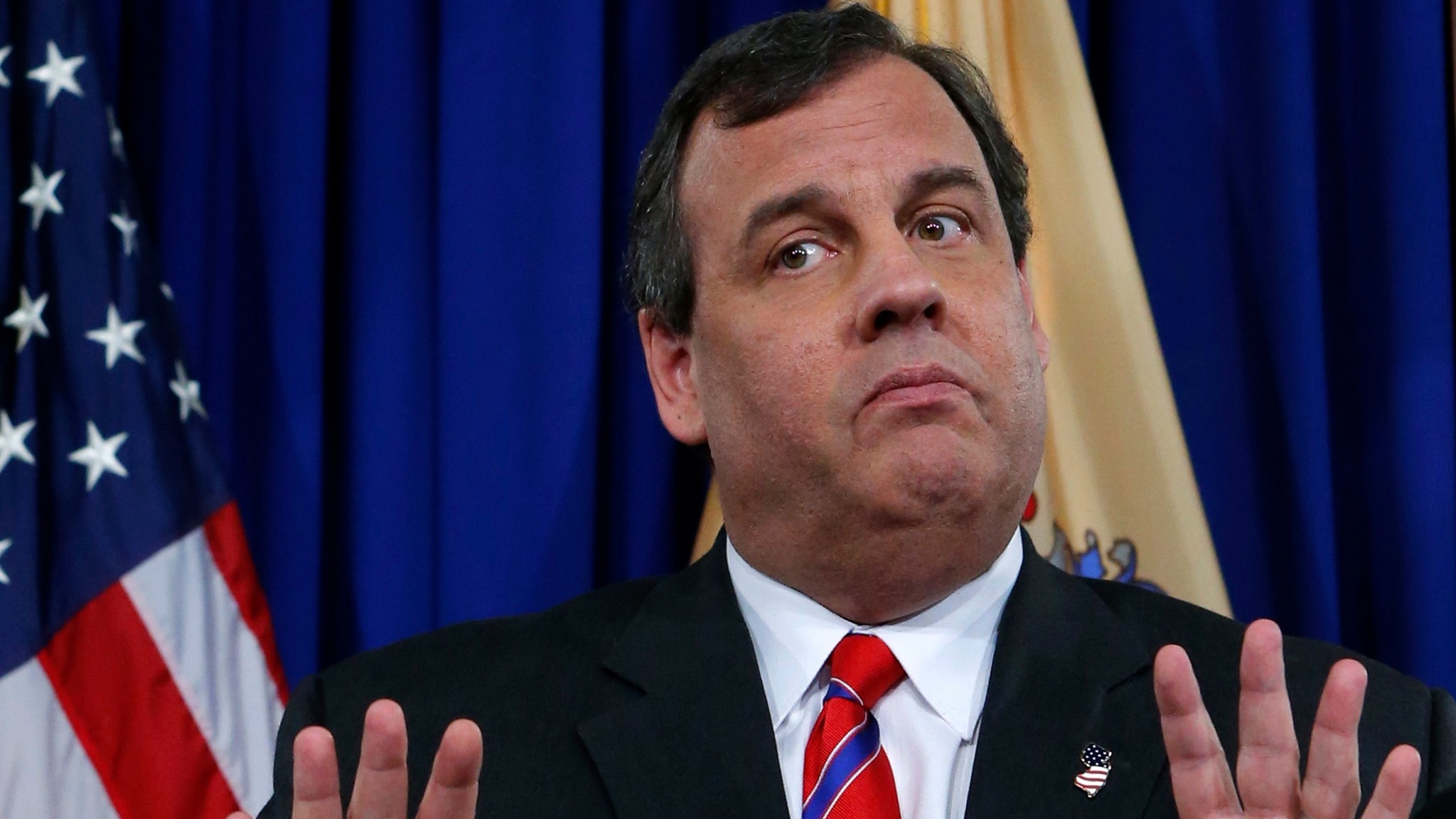 Chris Christie, a prominent figure in the Republican Party, gestures during a press conference