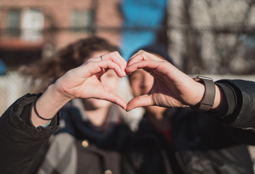 Two Person Bine Hand Forming A Heart Gesture Photo