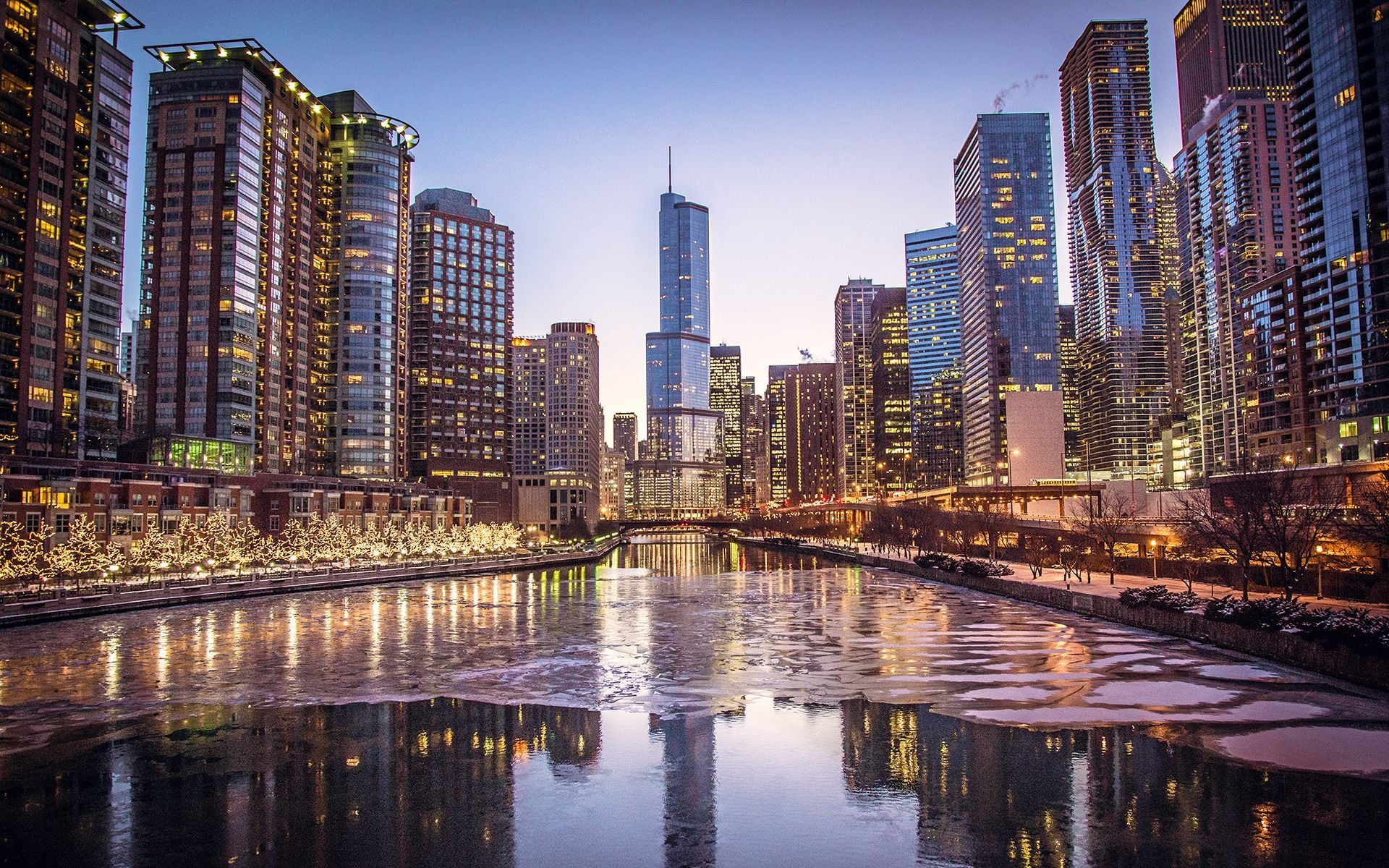 Stunning Chicago skyline at dusk reflected in the icy Chicago River