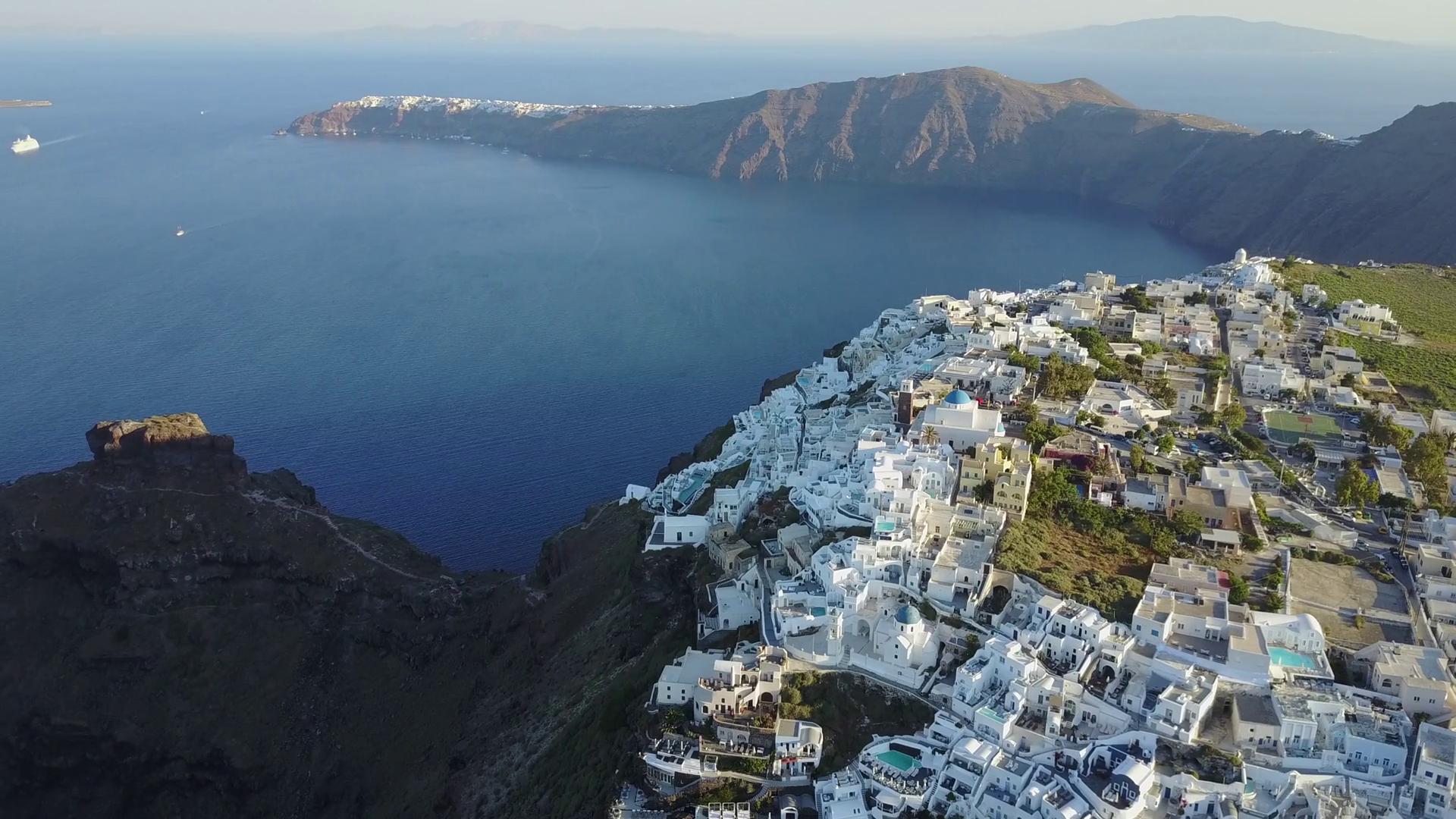 Aerial Footage Of A Cliffside Village In Santorini Greece Stock
