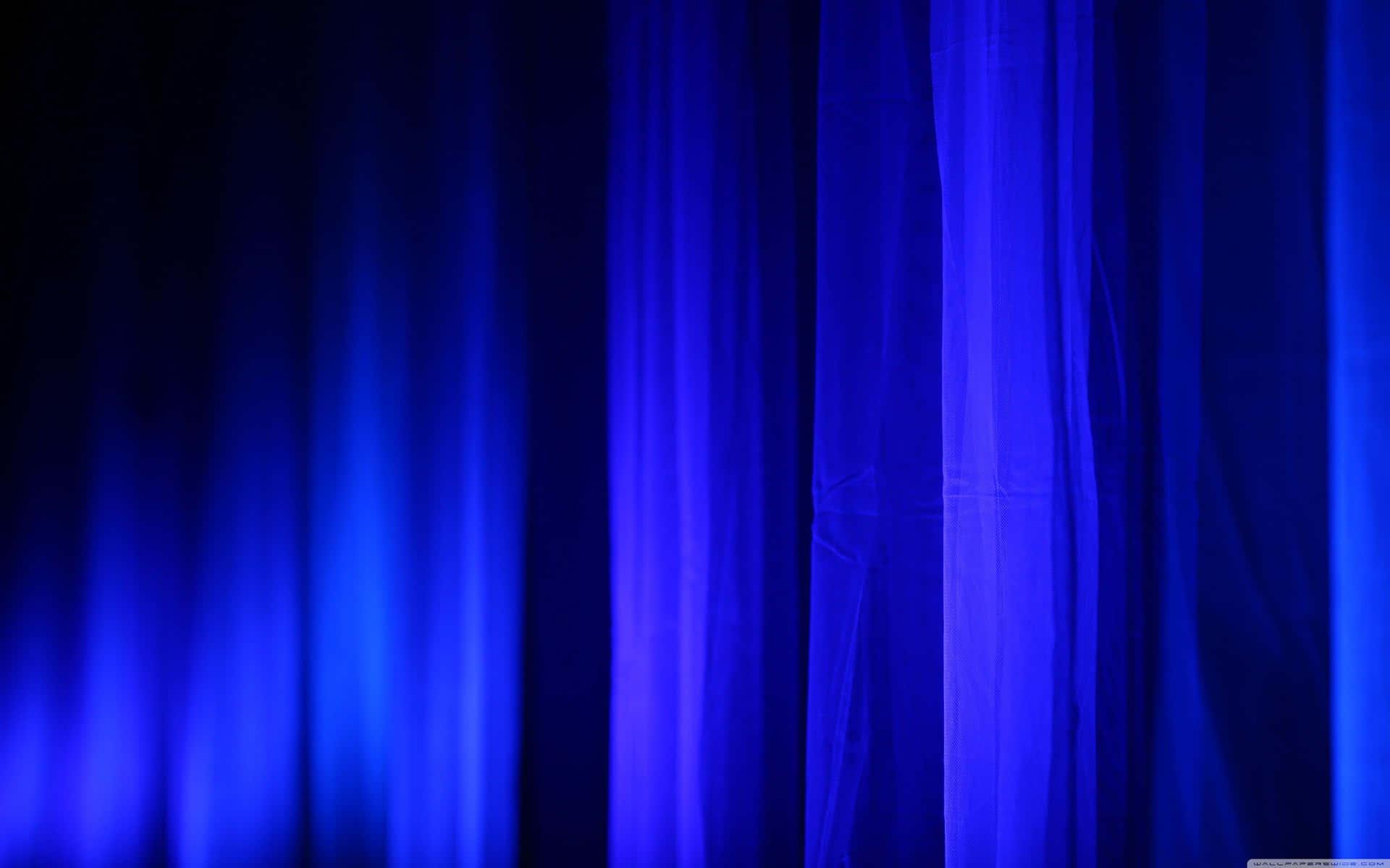 A Blue Curtain With Light Shining Through It