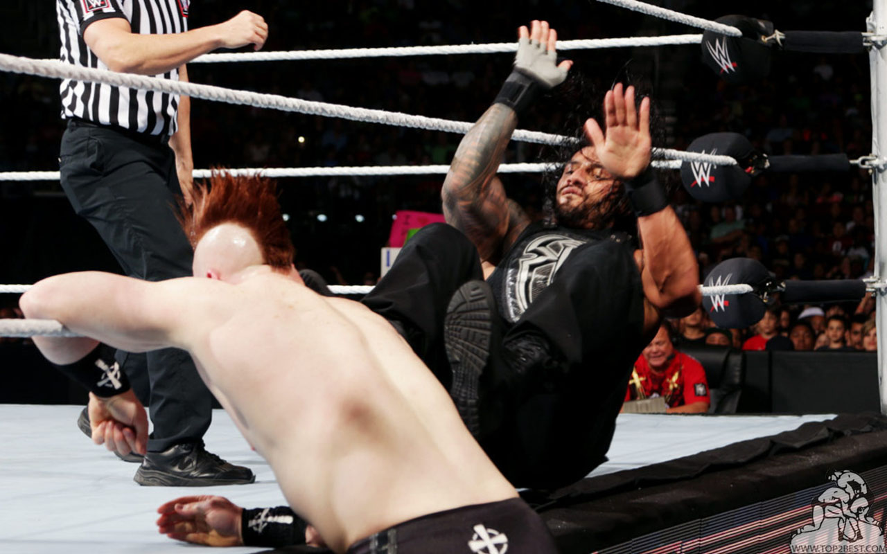 Roman Reigns Kick Outside Ring Picture