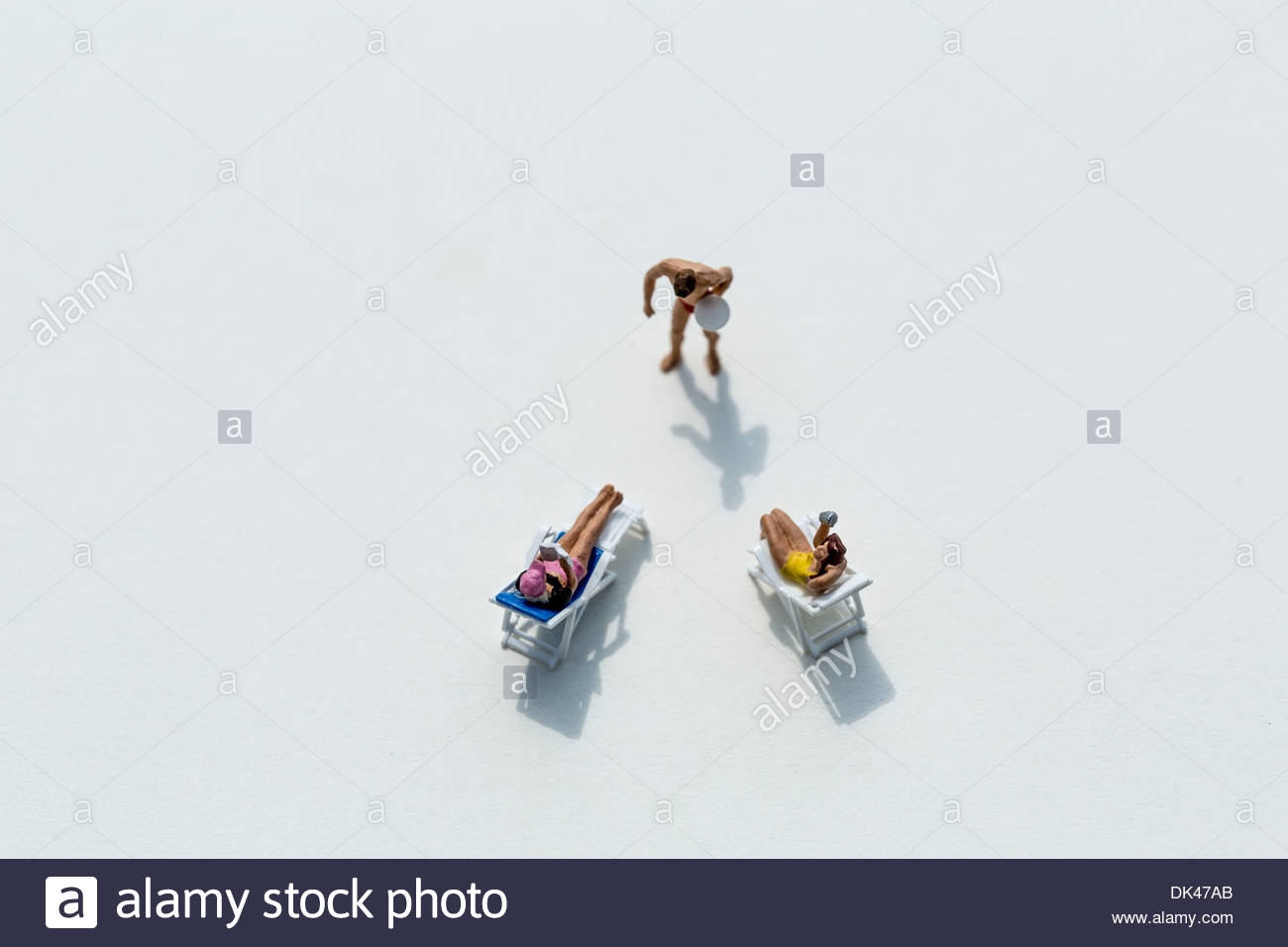 Figurines On A White Background Socializing At The Beach Club