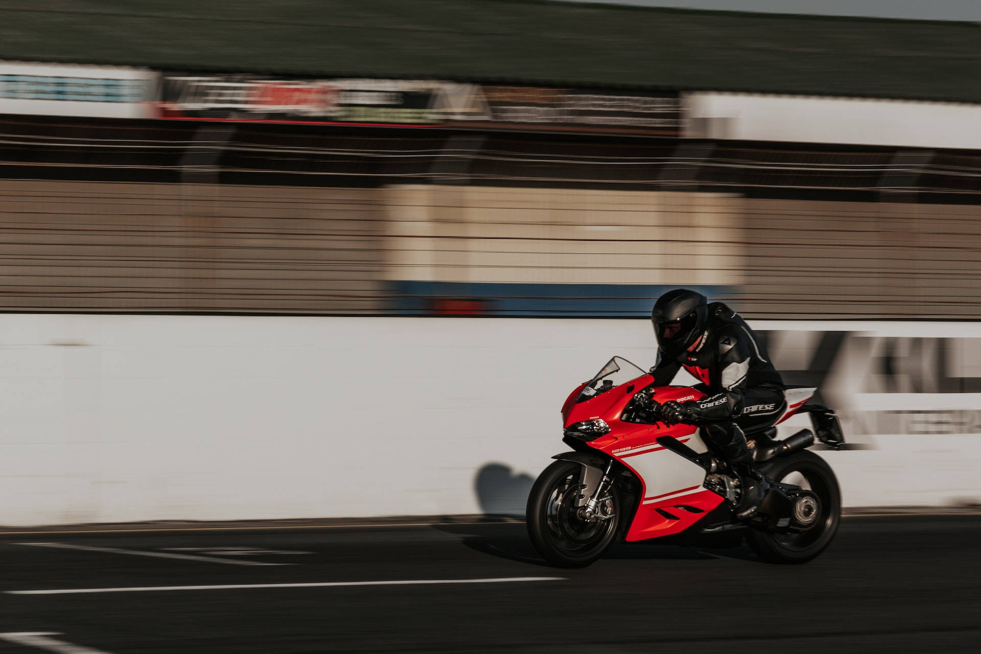 Bike Rider Speeding Through A Race Wallpaper
