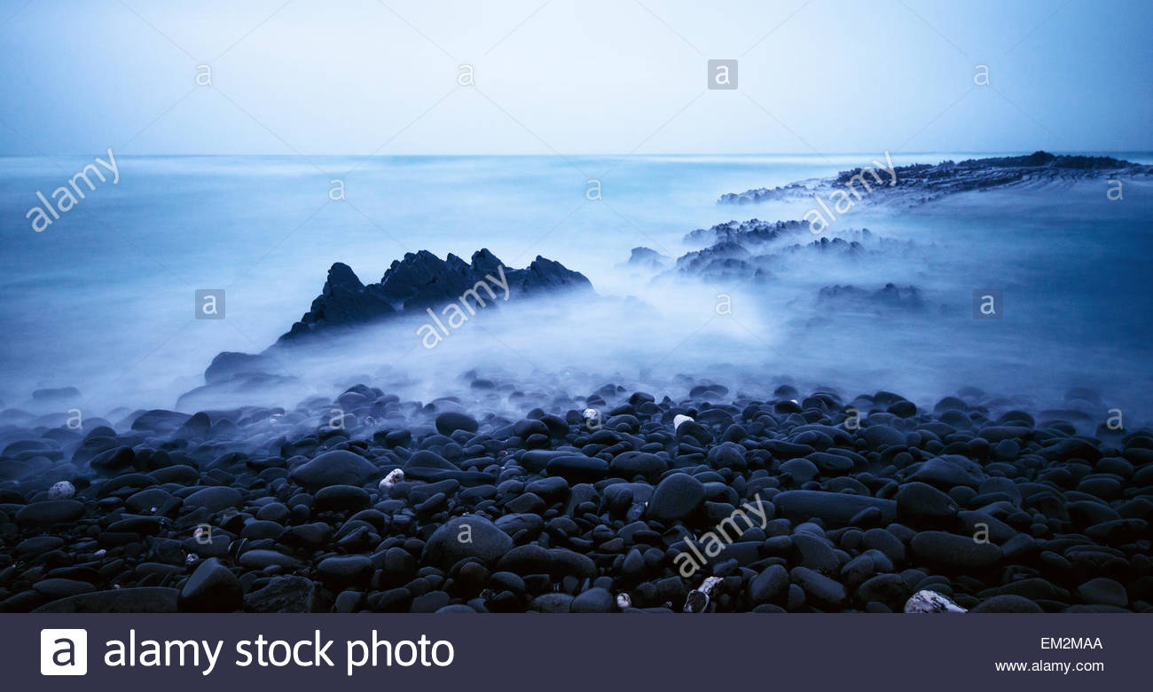 A Dark Ocean Coastline Background Stock Photo