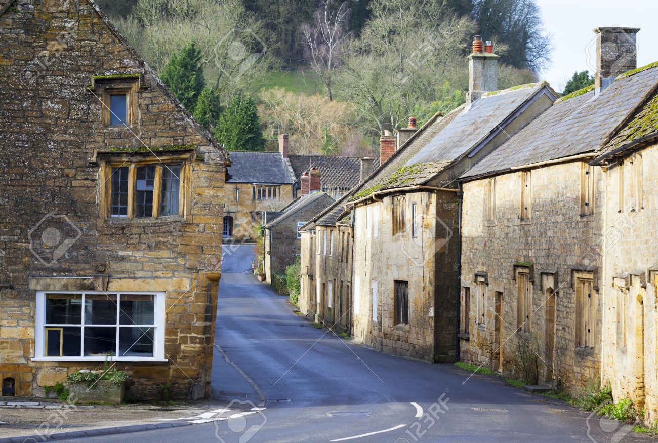 Old Stone Buildings On The High Street Of A Traditional English