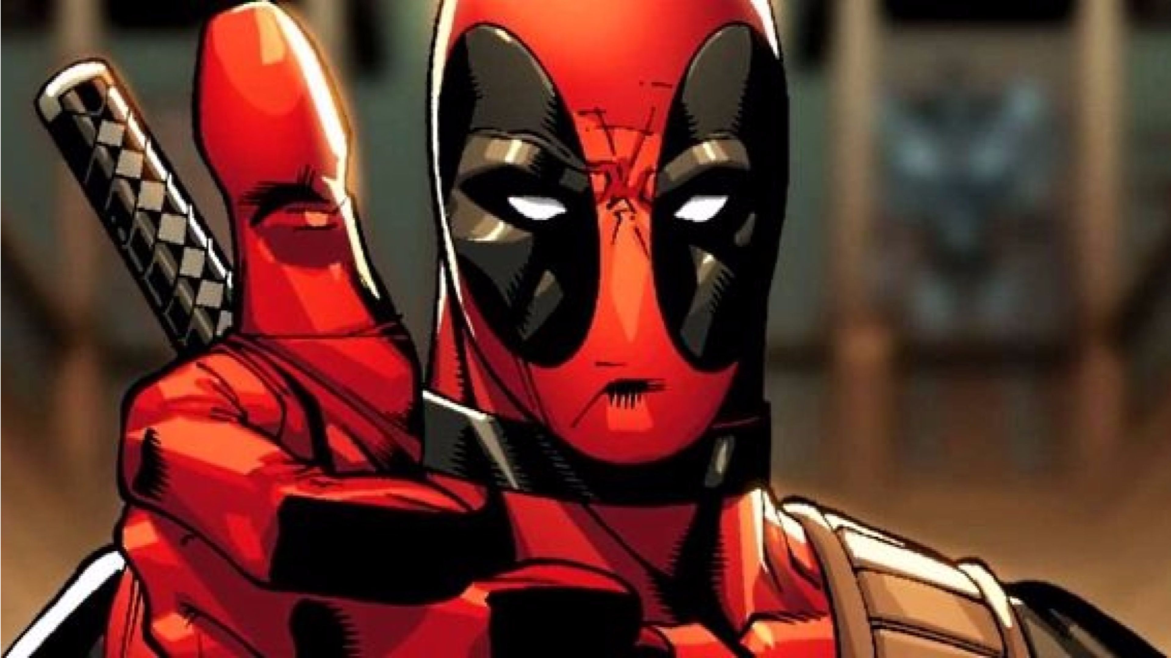 Close-up of Deadpool from Marvel Comics, making a gesture with his hand. He is wearing his signature red and black suit