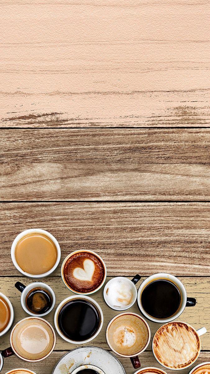 Mixed coffee cups on a pastel pink and brown wooden panel free