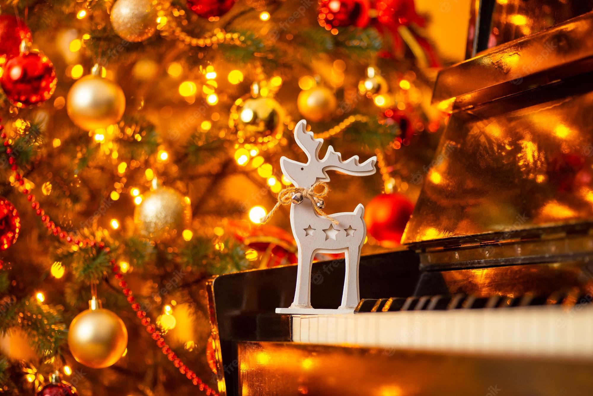 Premium Photo Wooden Deer Toy On The Piano Shiny Decorated