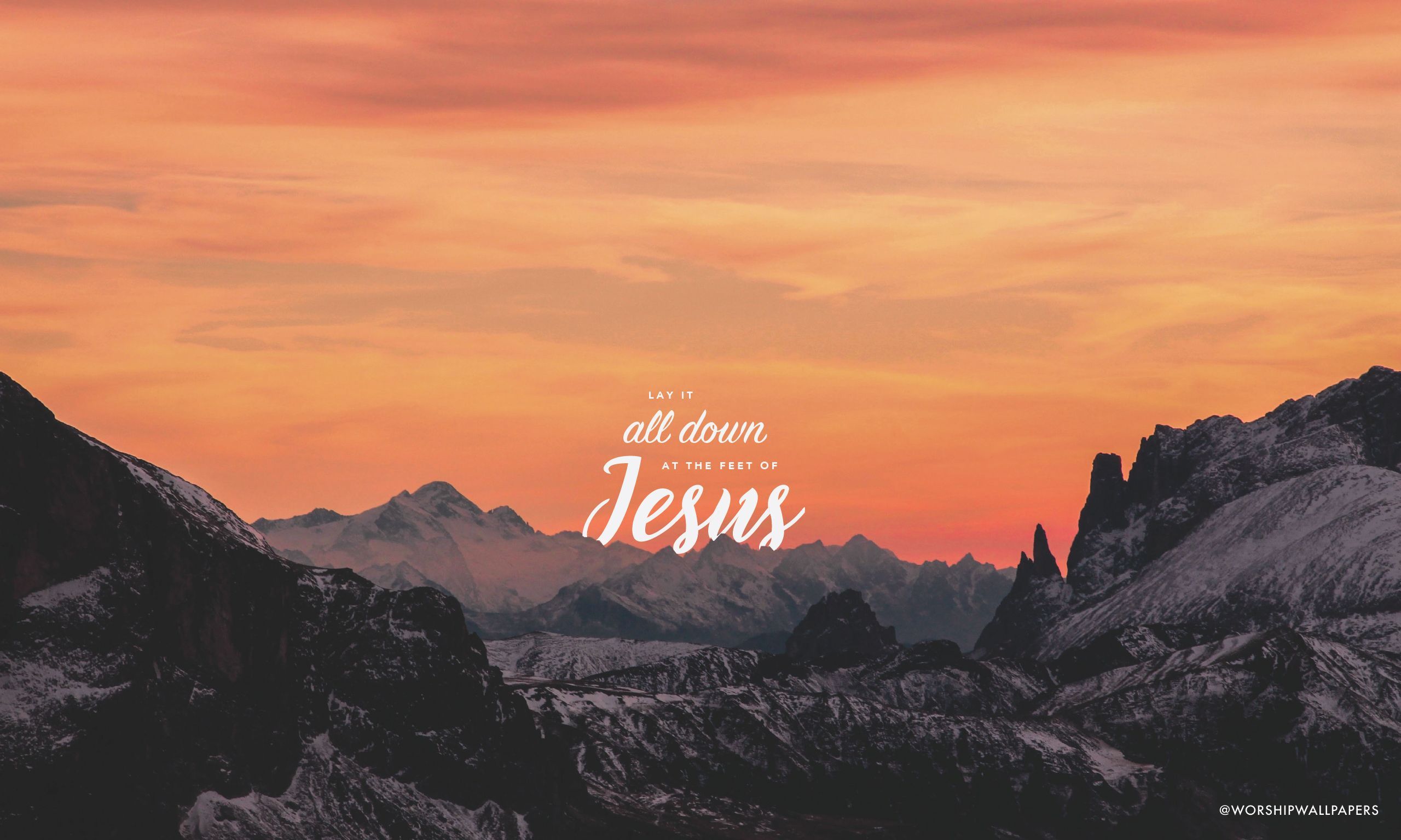 A breathtaking sunset over snow-capped mountains with the Bible verse overlay 