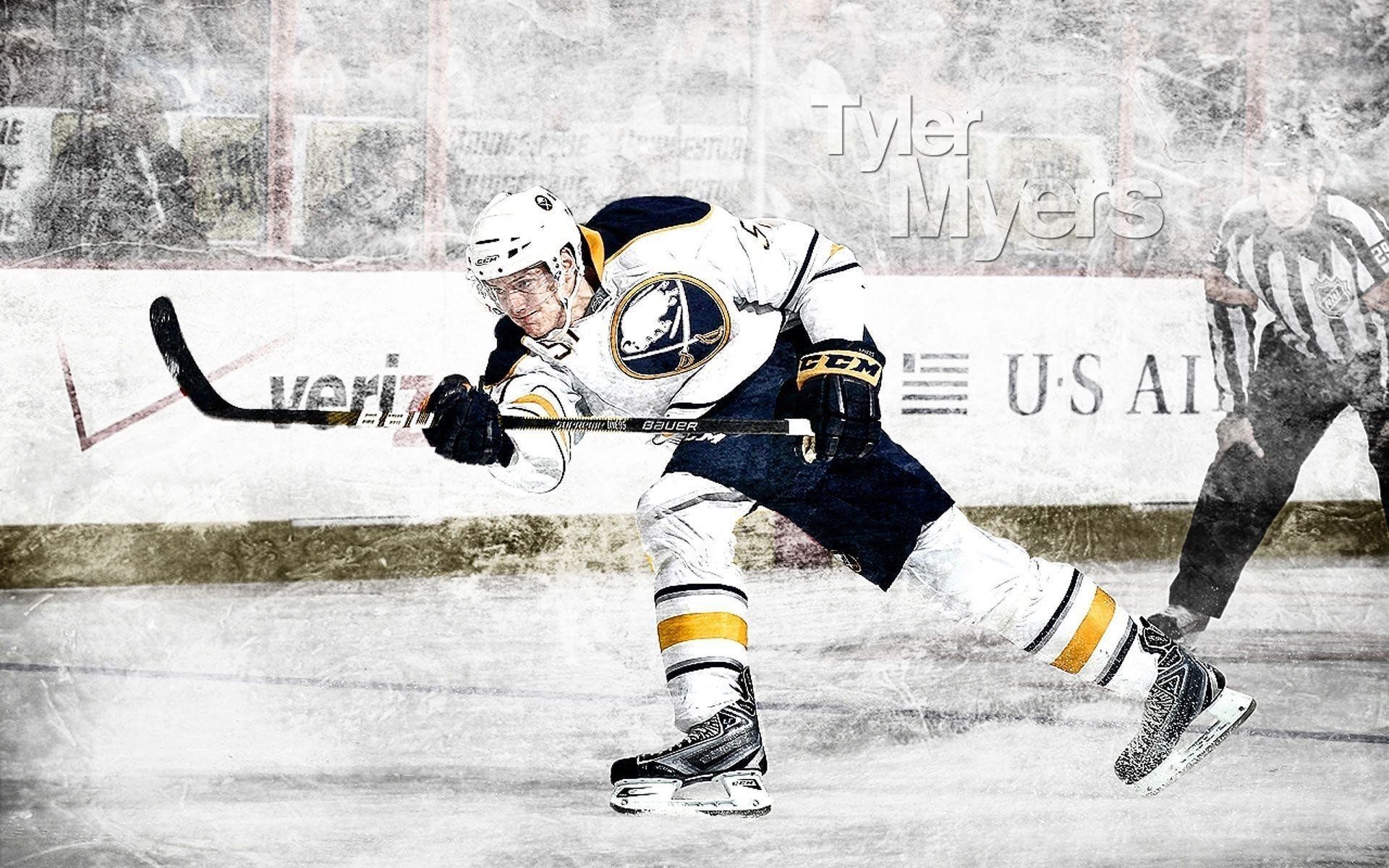 Tyler Myers of the Buffalo Sabres skating with the puck during an NHL hockey game