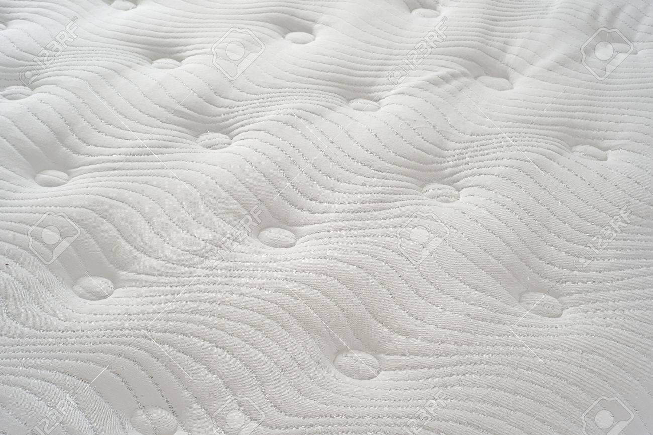 Background Of Soft Fortable Quilted White Mattress Stock Photo