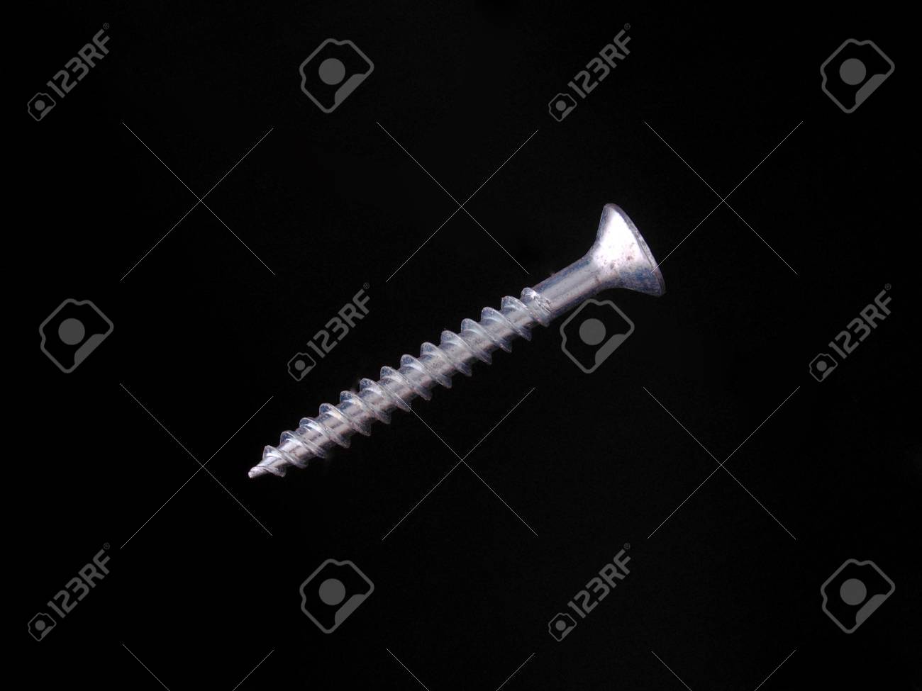 Steal Wood Screw On A Black Background Stock Photo Picture And