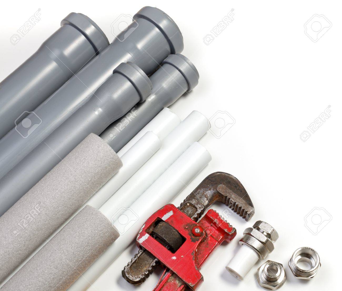 Plumbing Tool Pipes And Fittings On White Background Stock Photo