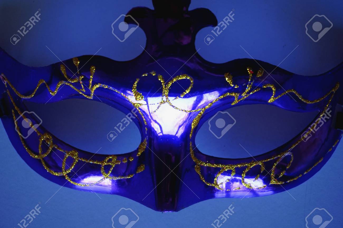 Anonymous Violet Carnaval Mack Isolated On Blue Background Stock