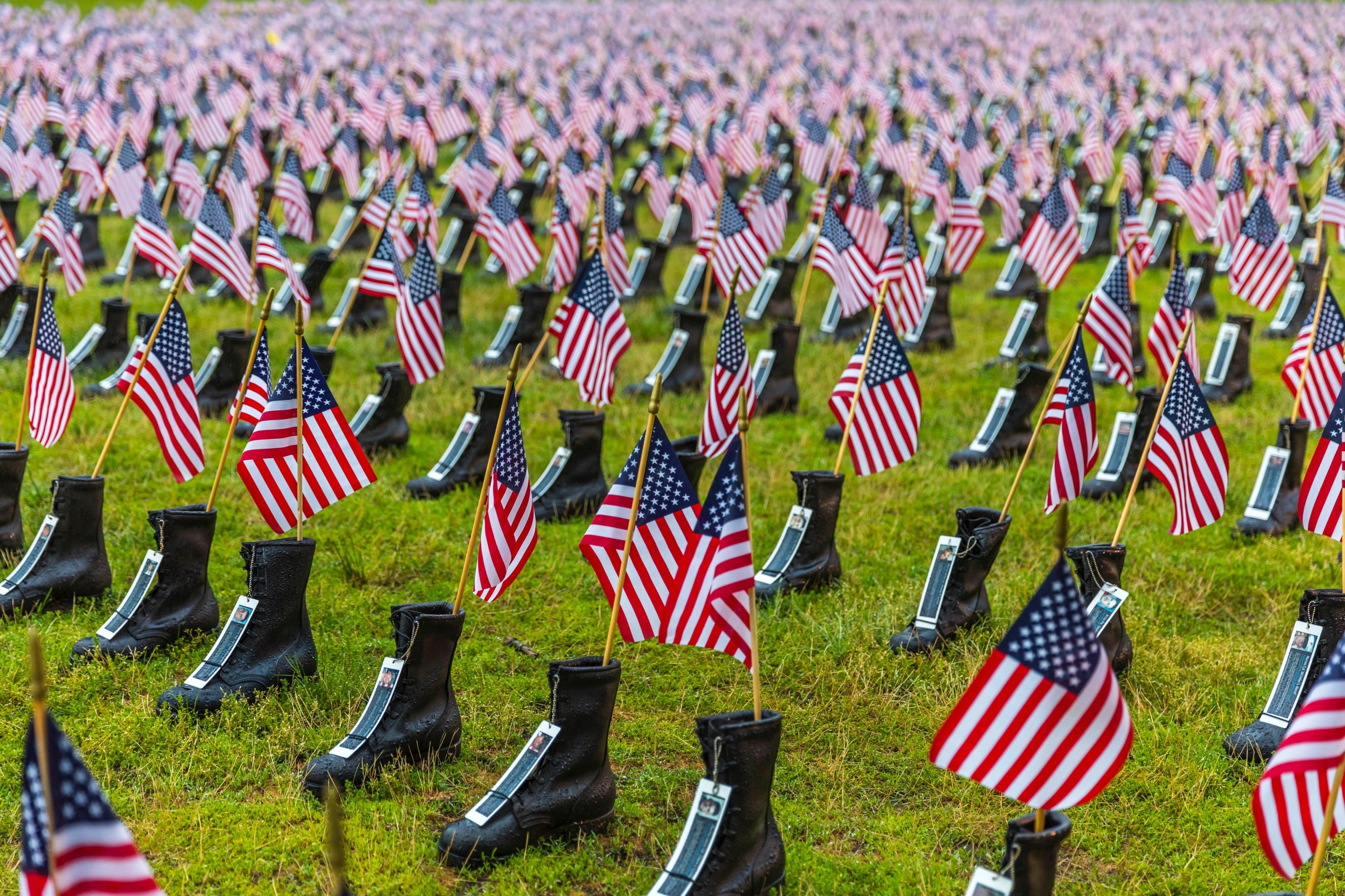 Wallpaper ID 250551 a memorial display of rows of boots with