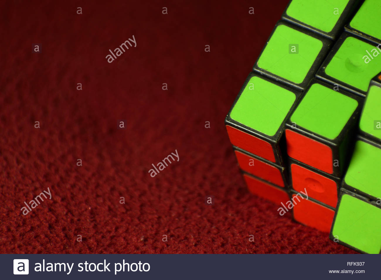 Rubik S Cube On A Red Background Stock Photo