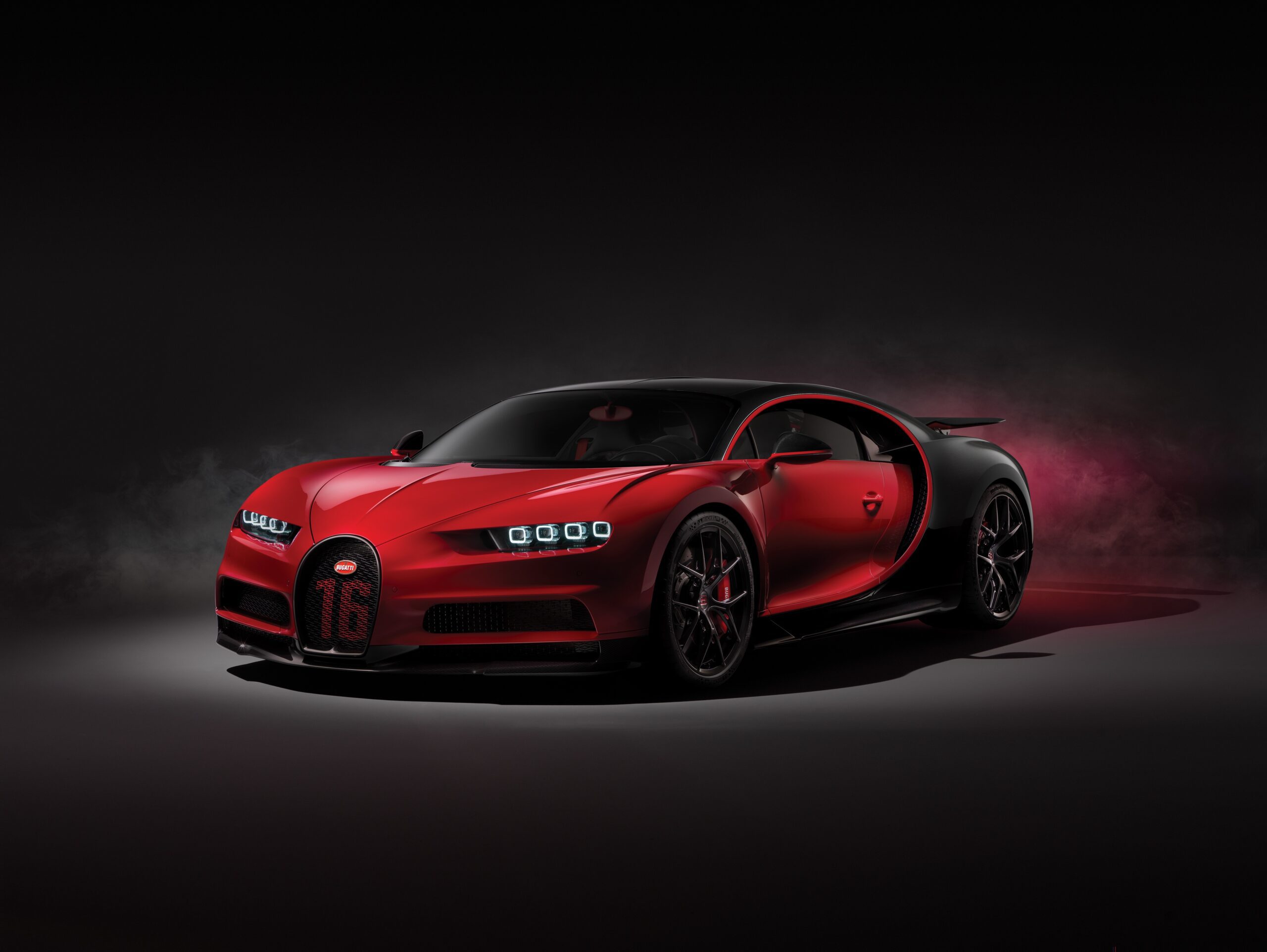 Red and Black Bugatti Chiron Supercar on a Dark Background