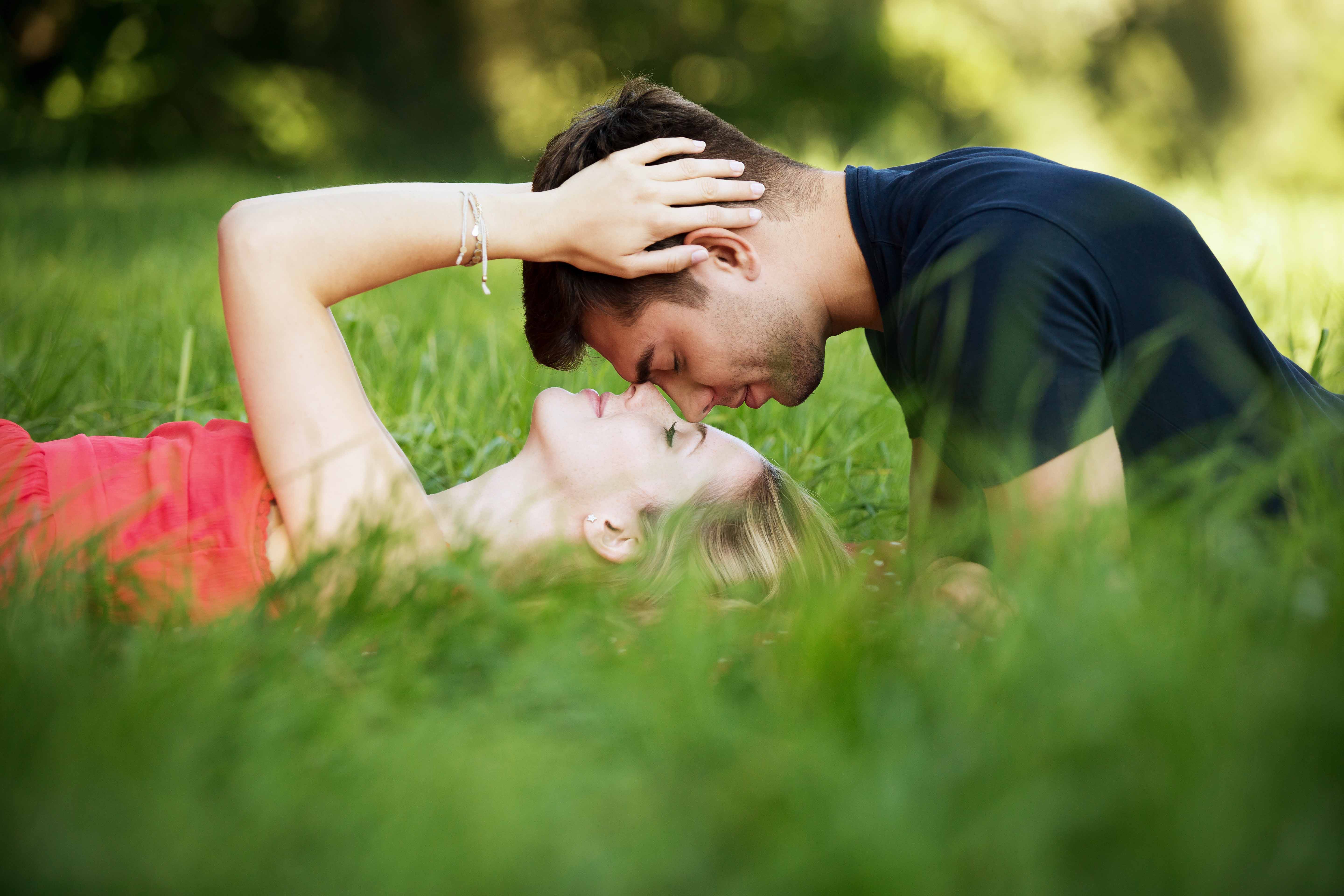 Stylish With Romantic Couple Kiss On Grass Love Wallpaper