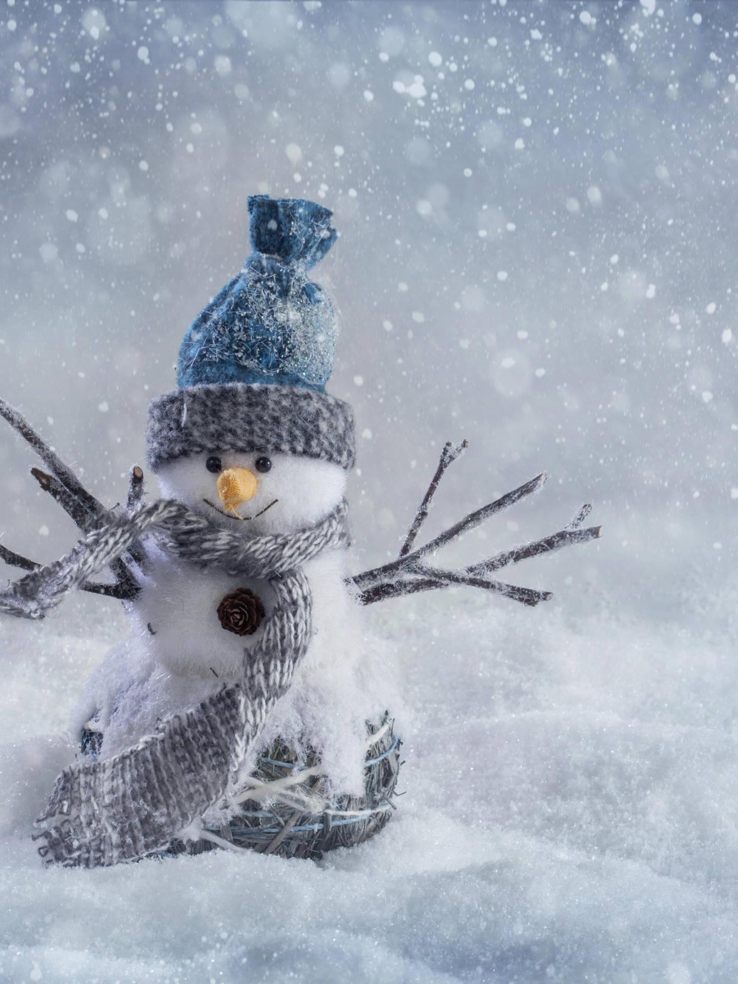 A Charming Winter Scene With Little Snowman On An