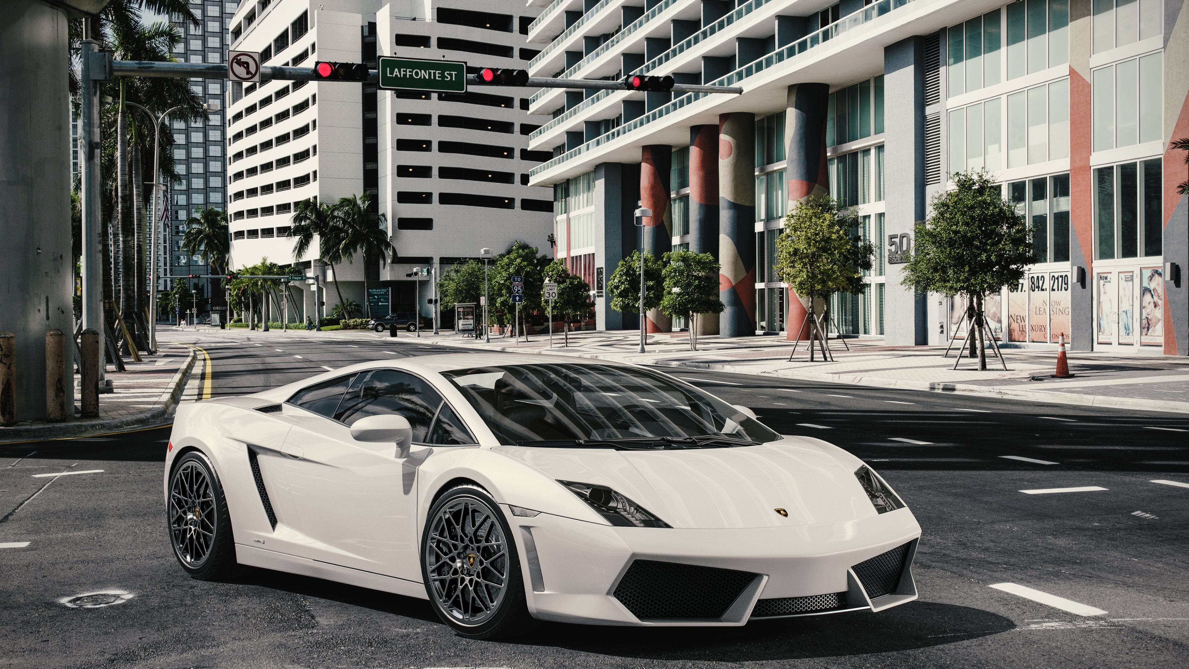 White Lamborghini Gallardo parked on a city street