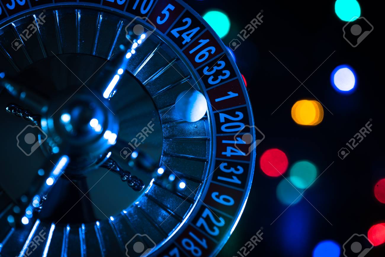 Roulette Wheel On A Black Background Stock Photo Picture And