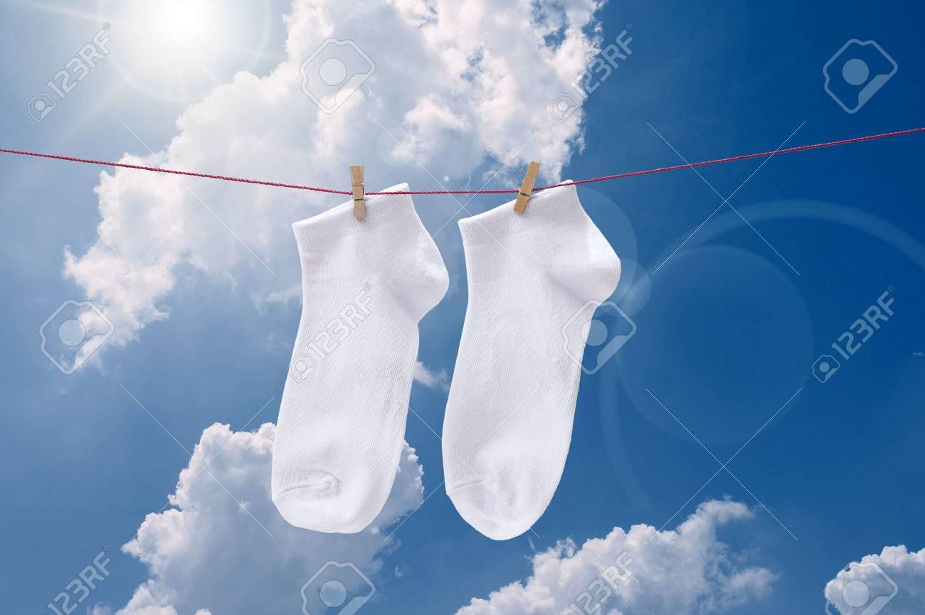 White Socks Hanging At Blue Sky Stock Photo Picture and Royalty