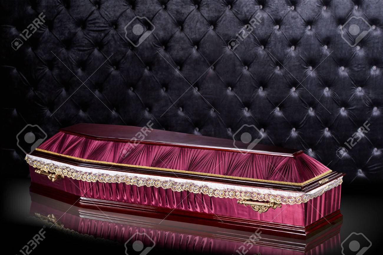 Closed Wooden Dark Brown Coffin Covered With A Cloth Isolated
